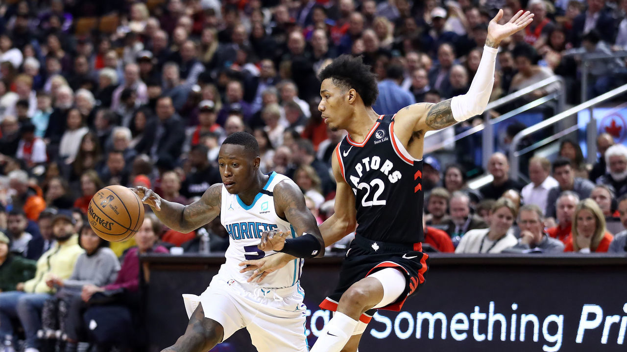 TORONTO, ON - FEBRUARY 28: Terry Rozier #3 of the Charlotte Hornets dribbles the ball as Patrick McCaw #22 of the Toronto Raptors defends during the first half of an NBA game at Scotiabank Arena on February 28, 2020 in Toronto, Canada.