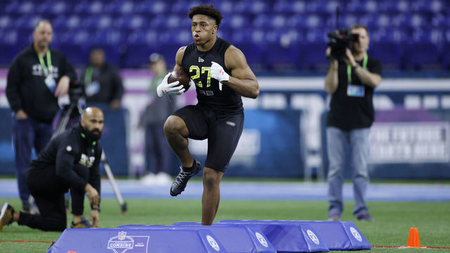 INDIANAPOLIS, IN - FEBRUARY 28: Running back Jonathan Taylor of Wisconsin runs a drill during the NFL Combine at Lucas Oil Stadium on February 28, 2020 in Indianapolis, Indiana.