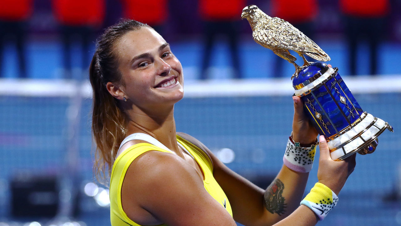 DOHA, QATAR - FEBRUARY 29: Aryna Sabalenka of Belarus celebrates with the trophy after victory against Petra Kvitova of Czech Republic in the Singles Final match on Day 7 of the WTA Qatar Total Open 2020 at Khalifa International Tennis and Squash Complex on February 29, 2020 in Doha, Qatar.