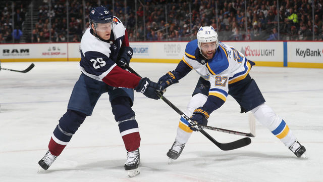 DENVER, CO - NOVEMBER 30: Nathan MacKinnon #29 of the Colorado Avalanche skates against Alex Pietrangelo #27 of the St. Louis Blues at the Pepsi Center on November 30, 2018 in Denver, Colorado.
