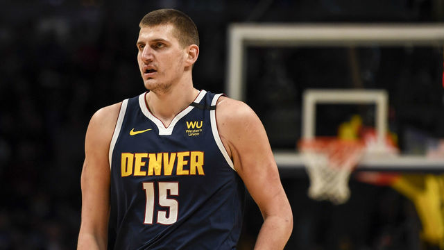 DENVER, CO - FEBRUARY 10: Nikola Jokic (15) of the Denver Nuggets after fouling Bryn Forbes (11) of the San Antonio Spurs to save a breakaway field goal during the first quarter on Monday, February 10, 2020.