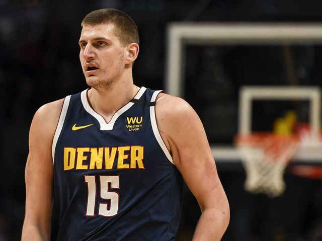 DENVER, CO - FEBRUARY 10: Nikola Jokic (15) of the Denver Nuggets after fouling Bryn Forbes (11) of the San Antonio Spurs to save a breakaway field goal during the first quarter on Monday, February 10, 2020.