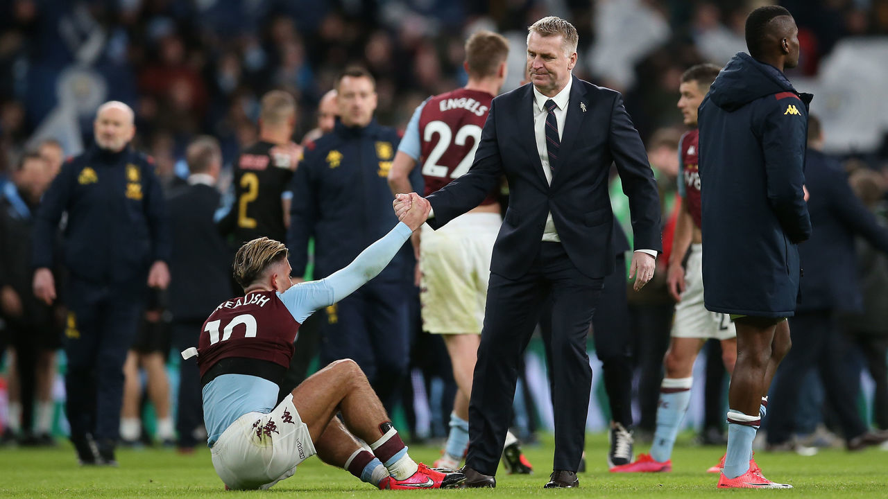 LONDON, ENGLAND - MARCH 01: The Aston Villa Manager, Dean Smith helps Jack Grealish of Aston Villa to his feet at the final whistle during the Carabao Cup Final between Aston Villa and Manchester City at Wembley Stadium on March 01, 2020 in London, England.