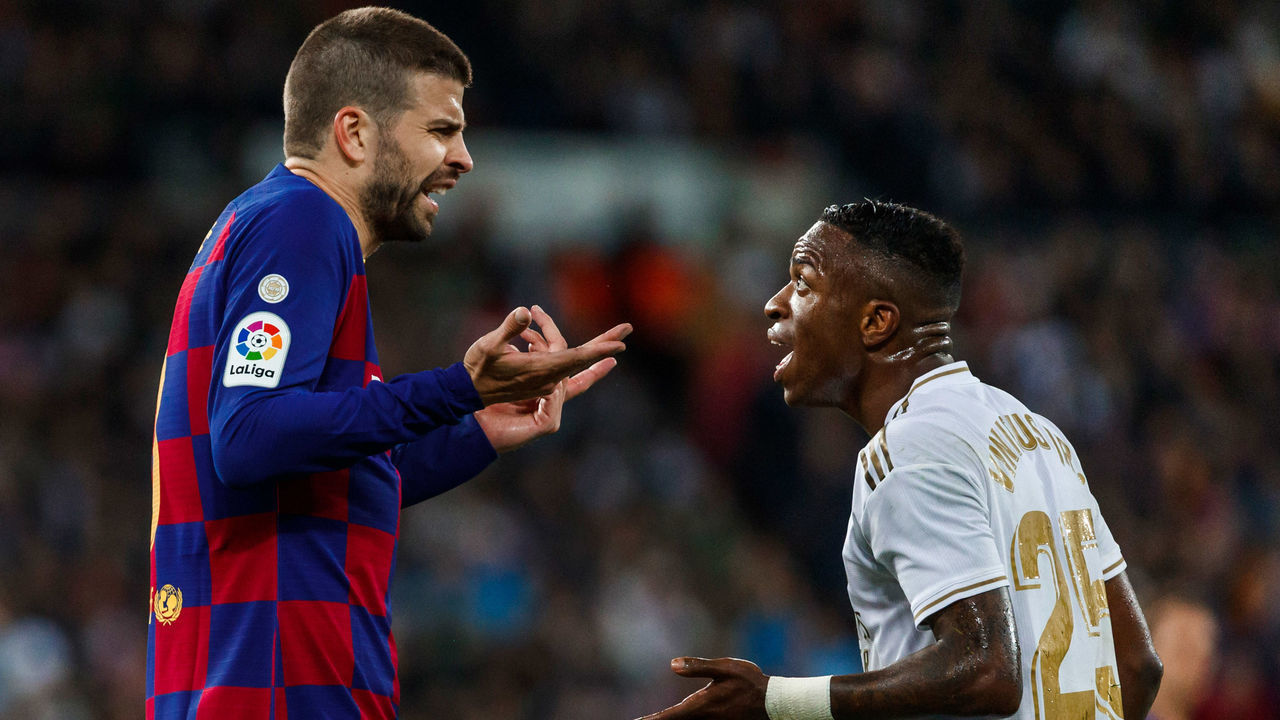 MADRID, SPAIN - MARCH 01: (BILD ZEITUNG OUT) Vinicius Junior of Real Madrid, Gerard Pique of FC Barcelona gestures during the Liga match between Real Madrid CF and FC Barcelona at Estadio Santiago Bernabeu on March 1, 2020 in Madrid, Spain.
