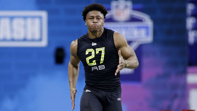 INDIANAPOLIS, IN - FEBRUARY 28: Running back Jonathan Taylor of Wisconsin runs the 40-yard dash during the NFL Combine at Lucas Oil Stadium on February 28, 2020 in Indianapolis, Indiana.