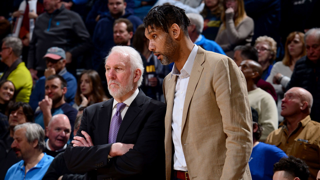 DENVER, CO - FEBRUARY 10: Gregg Popovich of the San Antonio Spurs and Tim Duncan of the San Antonio Spurs look on during a game against the Denver Nuggets on February 10, 2020 at the Pepsi Center in Denver, Colorado. NOTE TO USER: User expressly acknowledges and agrees that, by downloading and/or using this Photograph, user is consenting to the terms and conditions of the Getty Images License Agreement. Mandatory Copyright Notice: Copyright 2020 NBAE