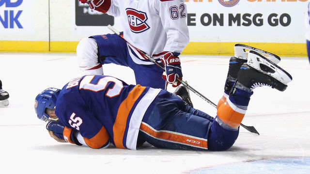 NEW YORK, NEW YORK - MARCH 03: Johnny Boychuk #55 of the New York Islanders is injured during the third period against the Montreal Canadiens at the Barclays Center on March 03, 2020 in the Brooklyn borough of New York City.