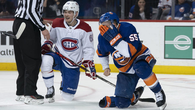 UNIONDALE, NY - MARCH 03: New York Islanders Defenceman Johnny Boychuk (55) grabs his face after getting kicked in the face by a skate from Montreal Canadiens Left Wing Artturi Lehkonen (62) during the third period of the National Hockey League game between the Montreal Canadiens and the New York Islanders on March 3, 2020, at the Barclays Center in Brooklyn, NY.