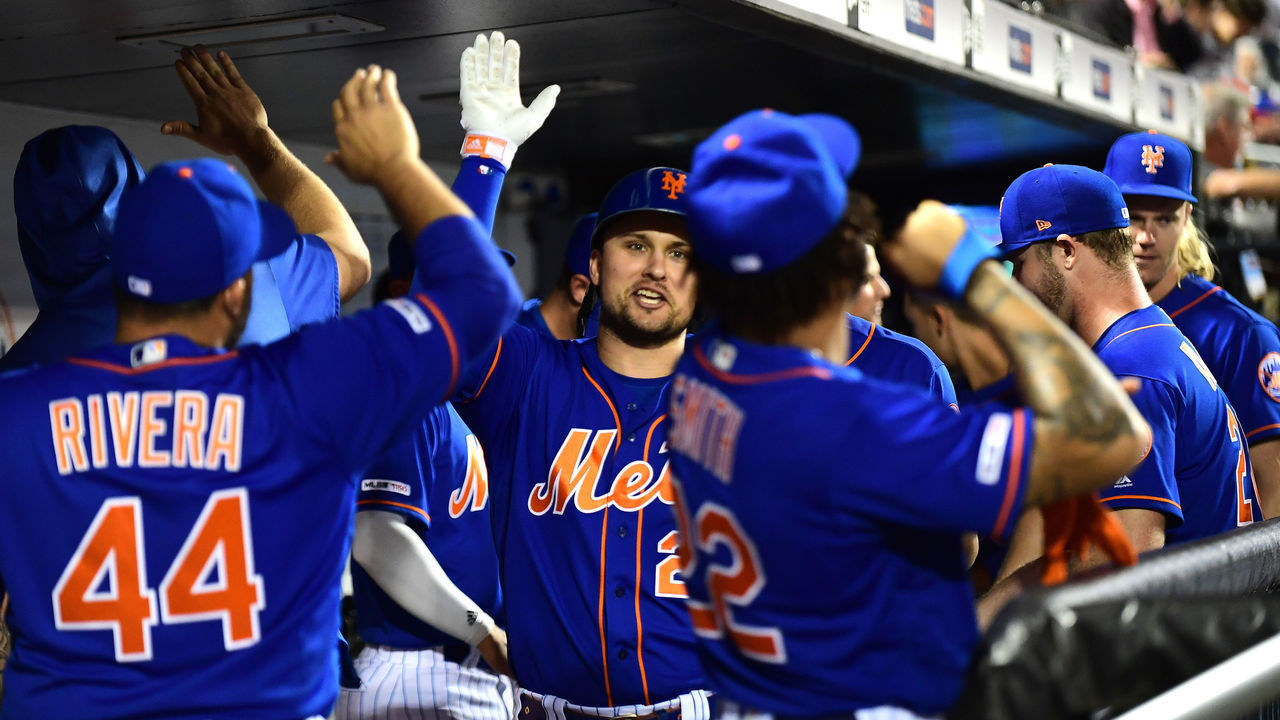 NEW YORK, NEW YORK - SEPTEMBER 27: J.D. Davis #28 of the New York Mets celebrates with teammates after his home run in the fourth inning of their game against the Atlanta Braves at Citi Field on September 27, 2019 in the Flushing neighborhood of the Queens borough of New York City.