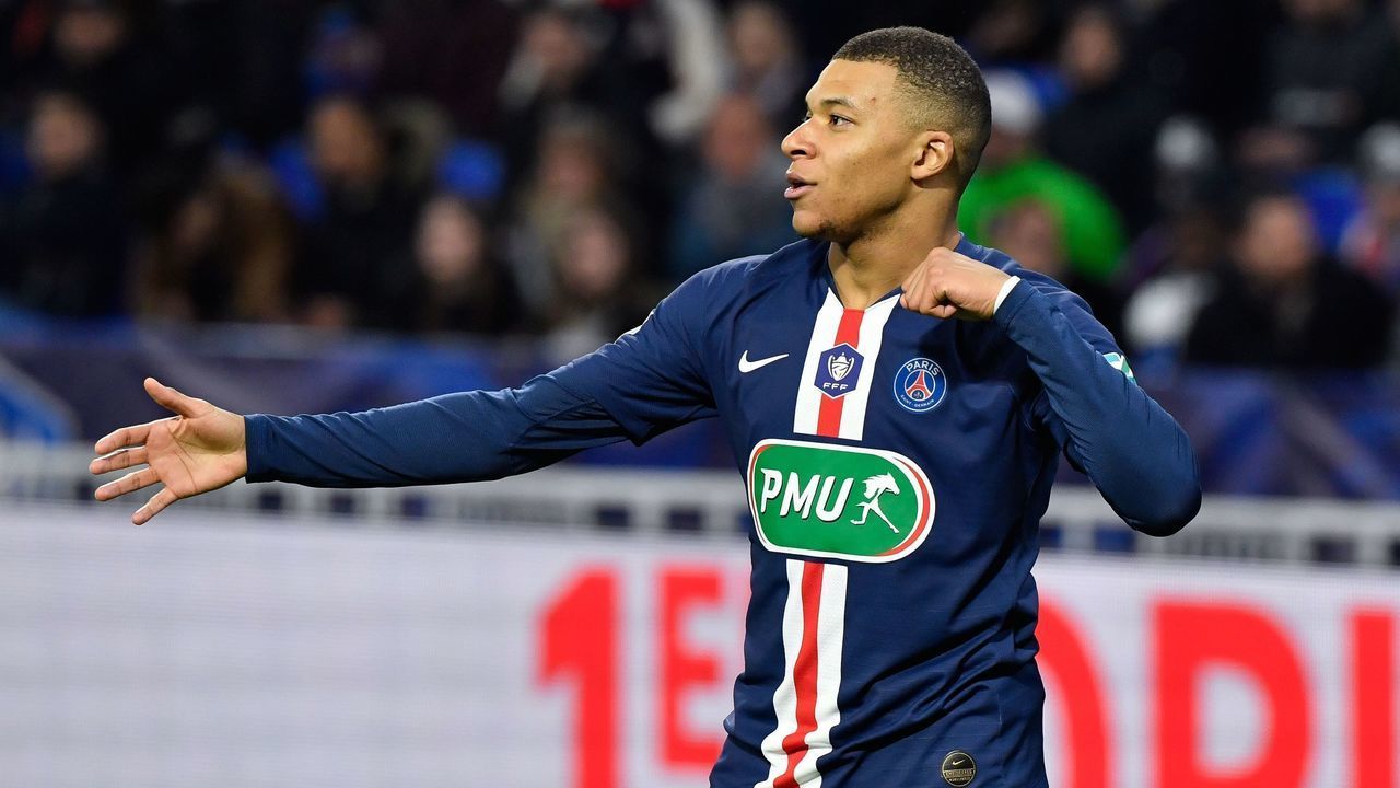 Paris Saint-Germain's French forward Kylian Mbappe celebrates after scoring a goal during the French Cup semi-final football match between Olympique Lyonnais (OL) and Paris Saint-Germain (PSG) at the Groupama Stadium in Decines-Charpieu, centraleastern France, on March 4, 2020.