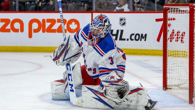WINNIPEG, MB - FEBRUARY 11: Goaltender Igor Shesterkin #31 of the New York Rangers makes a glove save during third period action against the Winnipeg Jets at the Bell MTS Place on February 11, 2020 in Winnipeg, Manitoba, Canada. The Rangers defeated the Jets 4-1.