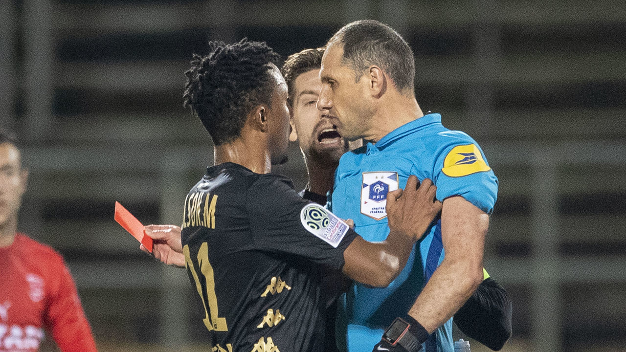 NIMES, FRANCE - February 01: Gelson Martins #11 of Monaco pushes referee Mikael Lesage after receiving a red card during the Nimes V Monaco, French Ligue 1, regular season match at Stade des Costieres on February 1st 2020, Nimes, France