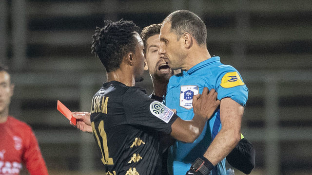 NIMES, FRANCE - February 01: Gelson Martins #11 of Monaco pushes referee Mikael Lesage after receiving a red card during the Nimes V Monaco, French Ligue 1, regular season match at Stade des Costieres on February 1st 2020, Nimes, France