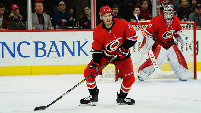 RALEIGH, NC - FEBRUARY 2: Brett Pesce #22 of the Carolina Hurricanes looks to shoot the puck during an NHL game against the Vancouver Canucks on February 2, 2020 at PNC Arena in Raleigh, North Carolina.