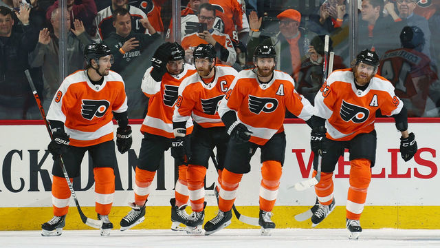 PHILADELPHIA, PA - MARCH 05: Sean Couturier #14 of the Philadelphia Flyers celebrates with Ivan Provorov #9, Matt Niskanen #15, Claude Giroux #28, and Jakub Voracek #93 after scoring a third perido goal against the Carolina Hurricanes on March 5, 2020 at the Wells Fargo Center in Philadelphia, Pennsylvania.