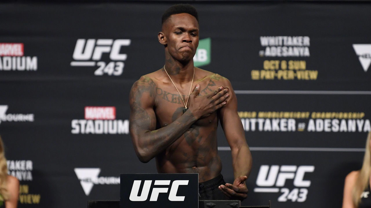 MELBOURNE, AUSTRALIA - OCTOBER 05: Israel Adesanya of New Zealand poses on the scale during the UFC 243 weigh-in at Marvel Stadium on October 05, 2019 in Melbourne, Australia.