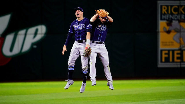 OAKLAND, CA - OCTOBER 02: Willy Adames #1 and Brandon Lowe #8 of the Tampa Bay Rays celebrate on the field after the Rays defeated the Oakland Athletics in the AL Wild Card game at Oakland Coliseum on Wednesday, October 2, 2019 in Oakland, California.
