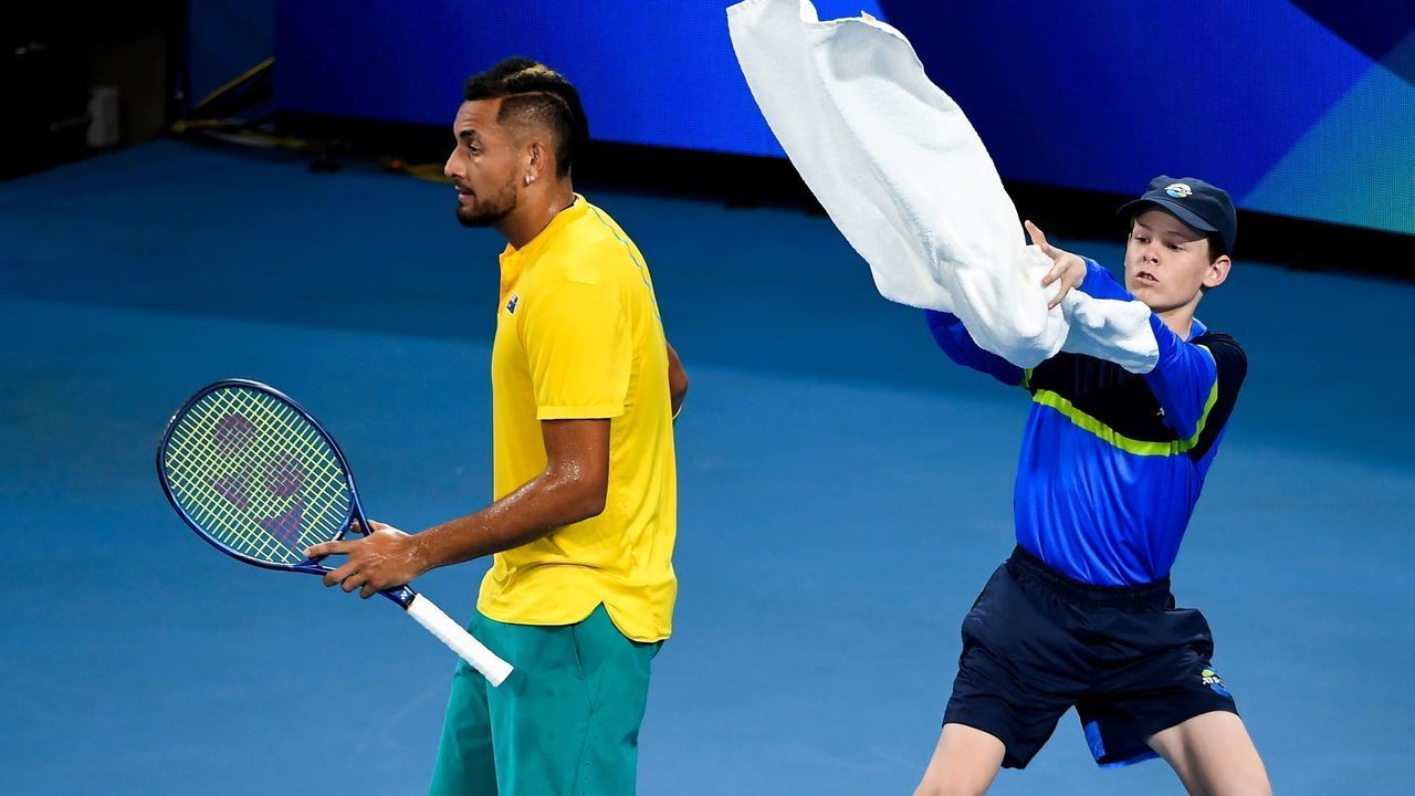 Nick Kyrgios of Australia throws his towel to a ballboy in his men's singles match against Roberto Bautista Agut of Spain at the ATP Cup tennis tournament in Sydney on January 11, 2020.