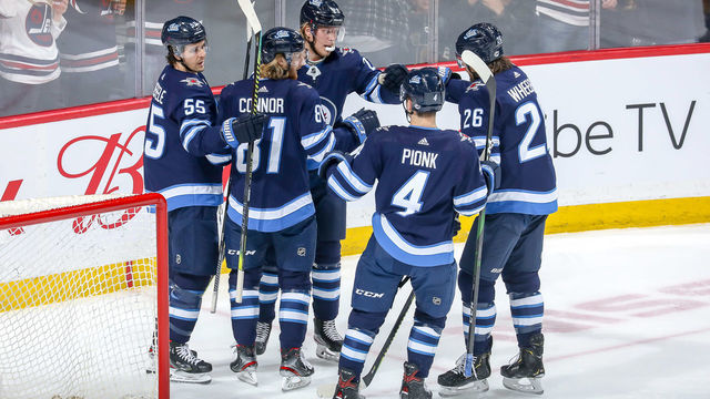 WINNIPEG, MB - MARCH 6: Mark Scheifele #55, Kyle Connor #81, Patrik Laine #29, Neal Pionk #4 and Blake Wheeler #26 of the Winnipeg Jets celebrate a first period goal against the Vegas Golden Knights at the Bell MTS Place on March 6, 2020 in Winnipeg, Manitoba, Canada.