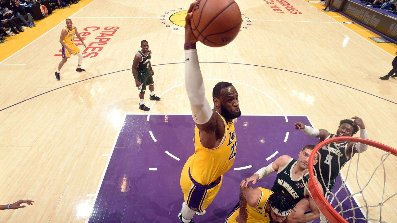 LOS ANGELES, CA - MARCH 6: LeBron James #23 of the Los Angeles Lakers dunks the ball during the game against the Milwaukee Bucks on March 6, 2020 at STAPLES Center in Los Angeles, California. NOTE TO USER: User expressly acknowledges and agrees that, by downloading and/or using this Photograph, user is consenting to the terms and conditions of the Getty Images License Agreement. Mandatory Copyright Notice: Copyright 2020 NBAE