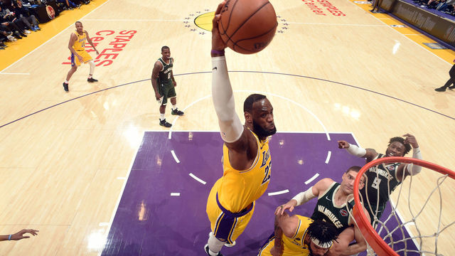 LOS ANGELES, CA - MARCH 6: LeBron James #23 of the Los Angeles Lakers dunks the ball during the game against the Milwaukee Bucks on March 6, 2020 at STAPLES Center in Los Angeles, California. NOTE TO USER: User expressly acknowledges and agrees that, by downloading and/or using this Photograph, user is consenting to the terms and conditions of the Getty Images License Agreement. Mandatory Copyright Notice: Copyright 2020 NBAE