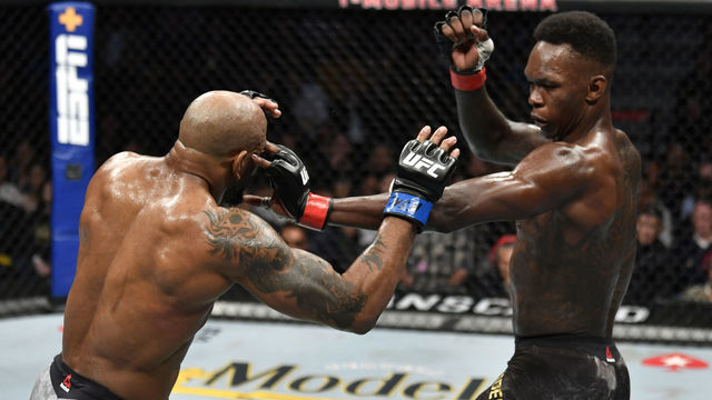 LAS VEGAS, NEVADA - MARCH 07: Israel Adesanya of Nigeria accidentally pokes the eye of Yoel Romero of Cuba in their UFC middleweight championship fight during the UFC 248 event at T-Mobile Arena on March 07, 2020 in Las Vegas, Nevada.