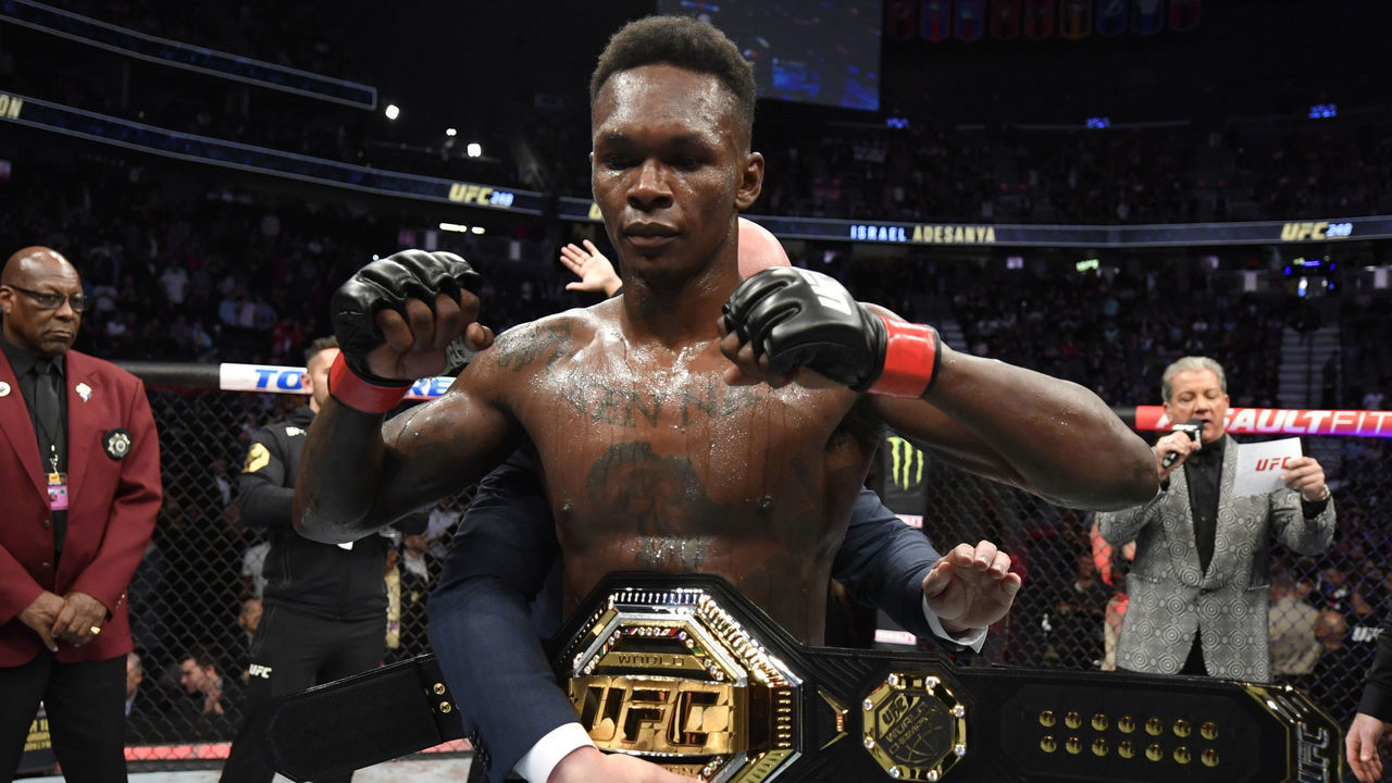 LAS VEGAS, NEVADA - MARCH 07: Israel Adesanya of Nigeria celebrates after defeating Yoel Romero of Cuba in their UFC middleweight championship fight during the UFC 248 event at T-Mobile Arena on March 07, 2020 in Las Vegas, Nevada.