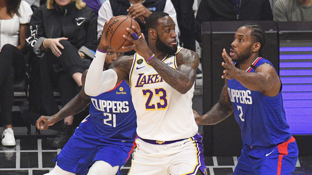 LOS ANGELES, CA - MARCH 08: Los Angeles Lakers Forward LeBron James (23) is guarded closely by Los Angeles Clippers Forward Kawhi Leonard (2) during a NBA game between the Los Angeles Lakers and the Los Angeles Clippers on March 8, 2020 at STAPLES Center in Los Angeles, CA.