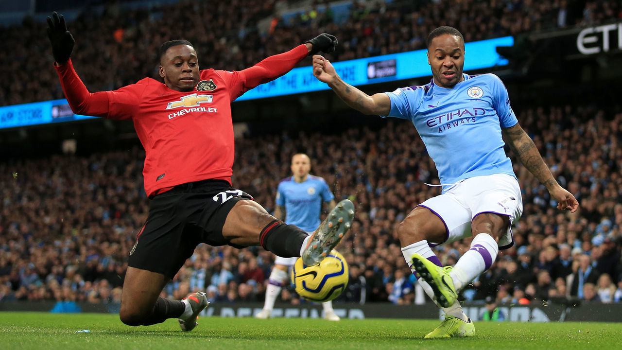 MANCHESTER, ENGLAND - DECEMBER 07: Raheem Sterling of Man City battles with Aaron Wan-Bissaka of Man Utd during the Premier League match between Manchester City and Manchester United at the Etihad Stadium on December 7, 2019 in Manchester, United Kingdom.