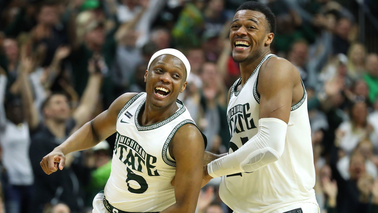 EAST LANSING, MICHIGAN - MARCH 08: Cassius Winston #5 of the Michigan State Spartans celebrates a second half three pointer with Xavier Tillman Sr. #23 while playing the Ohio State Buckeyes at the Breslin Center on March 08, 2020 in East Lansing, Michigan. Michigan State won the game 80-69.