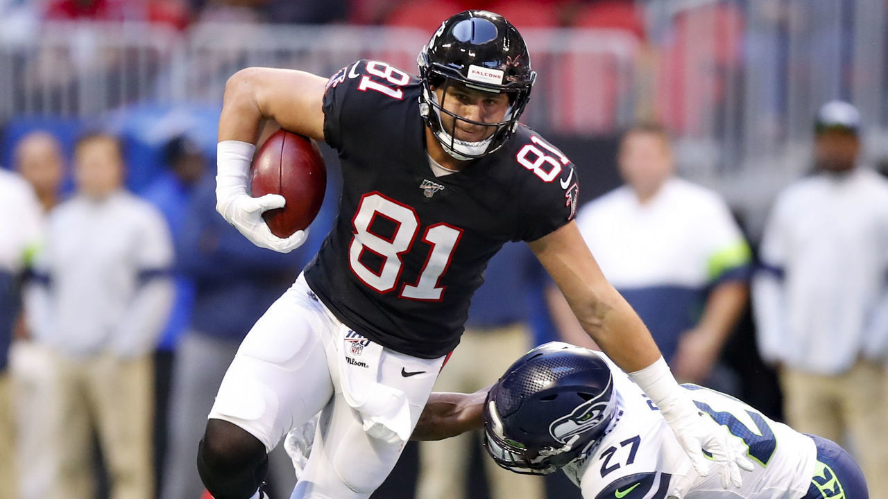 ATLANTA, GA - OCTOBER 27: Austin Hooper #81 of the Atlanta Falcons attempts to avoid a tackle of Marquise Blair #27 of the Seattle Seahawks in the second half of an NFL game at Mercedes-Benz Stadium on October 27, 2019 in Atlanta, Georgia.