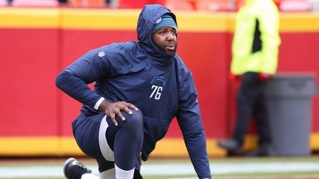KANSAS CITY, MO - DECEMBER 29: Los Angeles Chargers offensive tackle Russell Okung (76) stretches before an AFC West game between the Los Angeles Chargers and Kansas City Chiefs on December 29, 2019 at Arrowhead Stadium in Kansas City, MO.