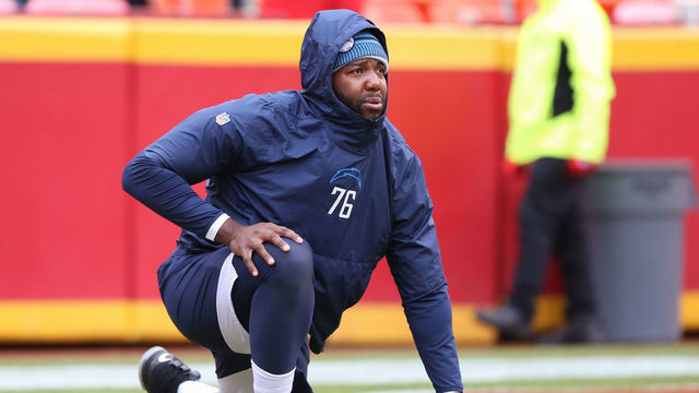 KANSAS CITY, MO - DECEMBER 29: Los Angeles Chargers offensive tackle Russell Okung (76) stretches before an AFC West game between the Los Angeles Chargers and Kansas City Chiefs on December 29, 2019 at Arrowhead Stadium in Kansas City, MO.