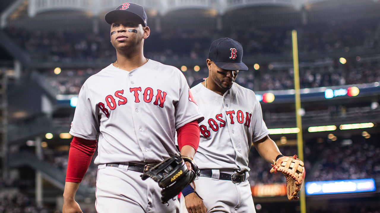 NEW YORK - MAY 31: Rafael Devers #11 and Xander Bogaerts #2 of the Boston Red Sox return to the dugout in-between innings during the game against the New York Yankees at Yankee Stadium on May 31, 2019 in the Bronx borough of New York City.