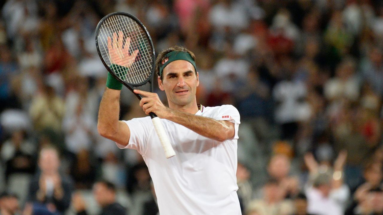 TOPSHOT - Switzerland's Roger Federer reacts after his victory against Spain's Rafael Nadal during their tennis match at The Match in Africa at the Cape Town Stadium, in Cape Town on February 7, 2020.