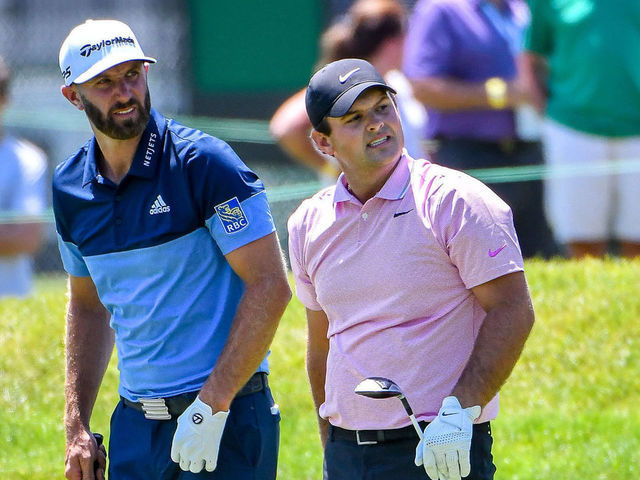 DETROIT, MI - JUNE 27: Dustin Johnson and Patrick Reed watch the approach shot by Johnson during the Rocket Mortgage Classic Golf Tournament on Friday June 27, 2019 at Detroit Golf Club in Detroit, MI.