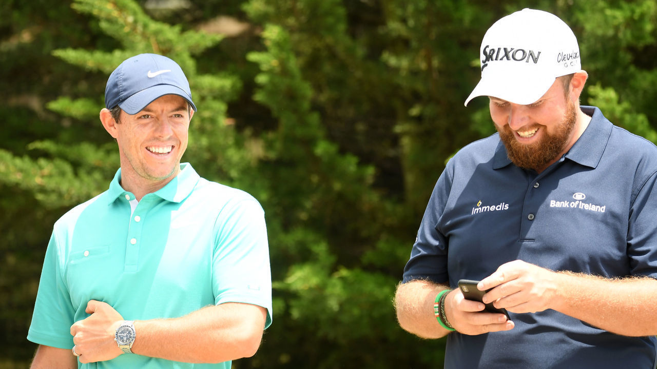 PEBBLE BEACH, CALIFORNIA - JUNE 11: (L-R) Rory McIlroy of Northern Ireland laughs with Shane Lowry of Northern Ireland during a practice round prior to the 2019 U.S. Open at Pebble Beach Golf Links on June 11, 2019 in Pebble Beach, California.