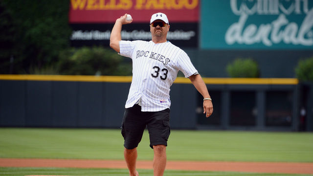 DENVER, CO - JUNE 30: Former Colorado Rockies player Larry Walker throws the ceremonial first pitch prior to the game against the San Francisco Giants at Coors Field on June 30, 2013 in Denver, Colorado.