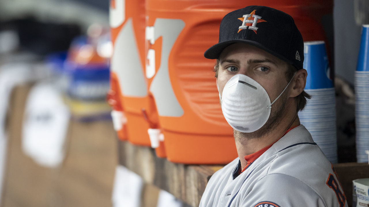 SEATTLE, WA - AUGUST 21: Josh Reddick #22 of the Houston Astros wears a mask while sitting on the bench in the dugout before a game against the Seattle Mariners at Safeco Field on August 21, 2018 in Seattle, Washington. The Astros won the game 3-2.