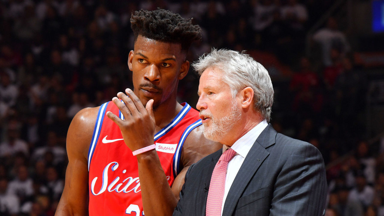 TORONTO, CANADA - MAY 12: Jimmy Butler #23 and Head Coach Brett Brown of the Philadelphia 76ers huddle together against the Toronto Raptors during Game Seven of the Eastern Conference Semi-Finals of the 2019 NBA Playoffs on May 12, 2019 at the Scotiabank Arena in Toronto, Ontario, Canada. Mandatory Copyright Notice: Copyright 2019 NBAE