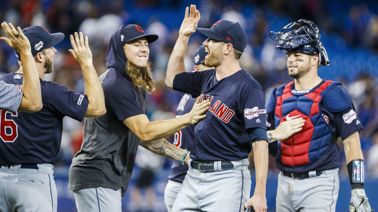 TORONTO, ONTARIO - JULY 24: Shane Bieber #57 of the Cleveland Indians celebrates his complete game shutout with Mike Clevinger #52 against the Toronto Blue Jays following their MLB game at the Rogers Centre on July 24, 2019 in Toronto, Canada.
