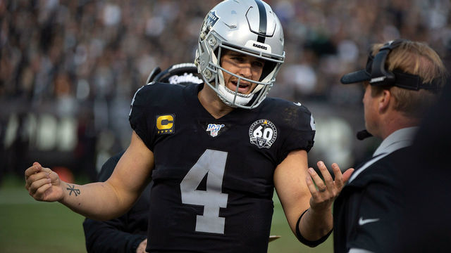 OAKLAND, CA - DECEMBER 15: Quarterback Derek Carr #4 of the Oakland Raiders talks to head coach Jon Gruden on the sidelines during the fourth quarter against the Jacksonville Jaguars at RingCentral Coliseum on December 15, 2019 in Oakland, California. The Jacksonville Jaguars defeated the Oakland Raiders 20-16.