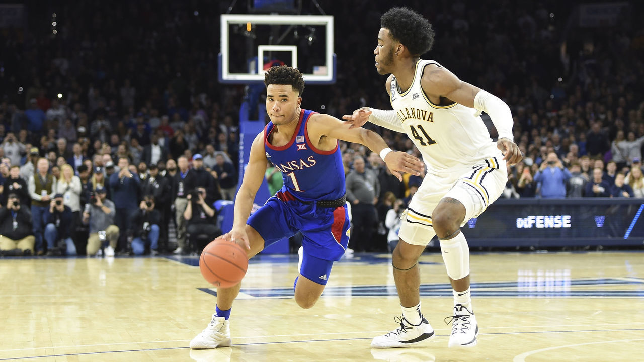 PHILADELPHIA, PA - DECEMBER 21: Kansas Jayhawks guard Devon Dotson (1) drives the lane past Villanova Wildcats forward Saddiq Bey (41) during the game between the Kansas Jayhawks and the Villanova Wildcats on December 21, 2019 at the Wells Fargo Center in Philadelphia, PA.