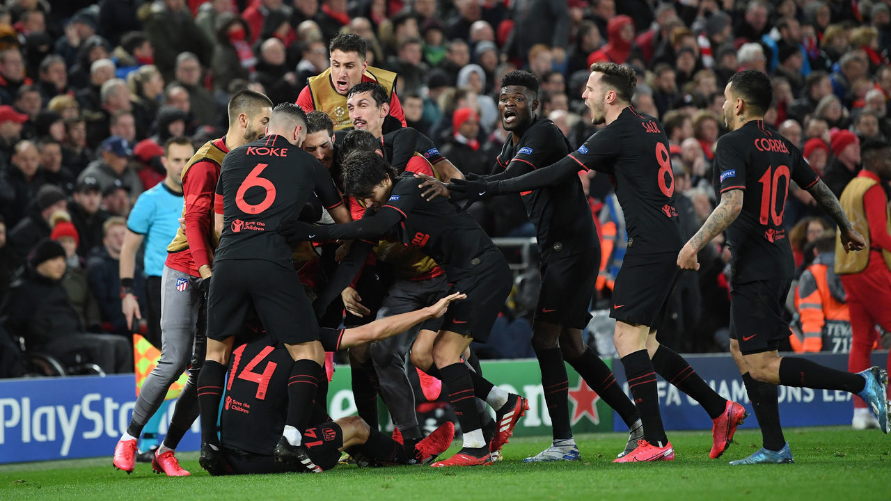LIVERPOOL, ENGLAND - MARCH 11: Marcos Llorente of Atletico Madrid celebrates with his team mates after scoring his team's first goal during the UEFA Champions League round of 16 second leg match between Liverpool FC and Atletico Madrid at Anfield on March 11, 2020 in Liverpool, United Kingdom.