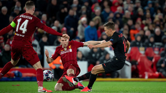 LIVERPOOL, ENGLAND - MARCH 11: (BILD ZEITUNG OUT) Marcos Llorente of Atletico Madrid scores his team's third goal during the UEFA Champions League round of 16 second leg match between Liverpool FC and Atletico Madrid at Anfield on March 11, 2020 in Liverpool, United Kingdom.