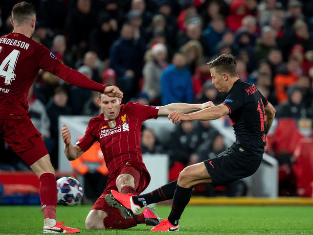 LIVERPOOL, ENGLAND - MARCH 11: (BILD ZEITUNG OUT) Marcos Llorente of Atletico Madrid scores his team's third goal during the UEFA Champions League round of 16 second leg match between Liverpool FC and Atletico Madrid at Anfield on March 11, 2020 in Liverpool, United Kingdom.