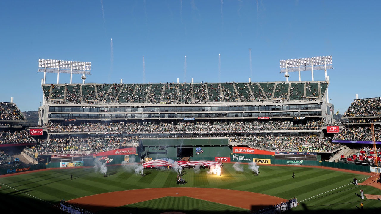 OAKLAND, CA - OCTOBER 02: Fireworks are seen as the national anthem is played before the Oakland Athletics take on the Tampa Bay Rays in their MLB American League wild card game at the Coliseum in Oakland, Calif., on Wednesday, Oct. 2, 2019.