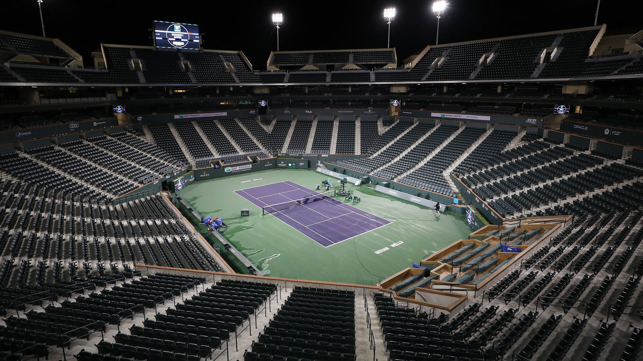 INDIAN WELLS, CALIFORNIA - MARCH 08: Courtmaster Jeffrey Brooker cleans the center court at the Indian Wells Tennis Garden on March 08, 2020 in Indian Wells, California. The BNP Paribas Open was cancelled by the Riverside County Public Health Department, as county officials declared a public health emergency when a case of coronavirus (COVID-19) was confirmed in the area.
