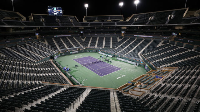 INDIAN WELLS, CALIFORNIA - MARCH 08: Courtmaster Jeffrey Brooker cleans the center court at the Indian Wells Tennis Garden on March 08, 2020 in Indian Wells, California. The BNP Paribas Open was cancelled by the Riverside County Public Health Department, as county officials declared a public health emergency when a case of coronavirus (COVID-19) was confirmed in the area.