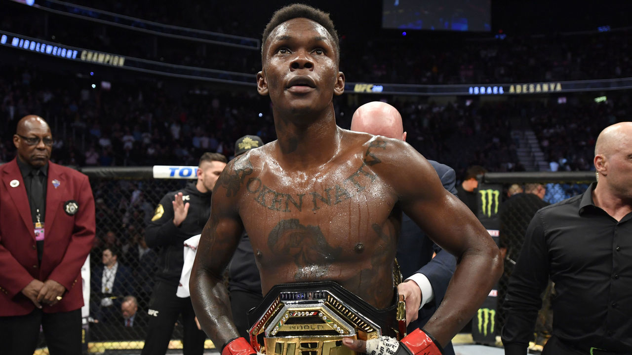 LAS VEGAS, NEVADA - MARCH 07: Israel Adesanya of Nigeria celebrates after defeating Yoel Romero of Cuba in their UFC middleweight championship fight during the UFC 248 event at T-Mobile Arena on March 07, 2020 in Las Vegas, Nevada.